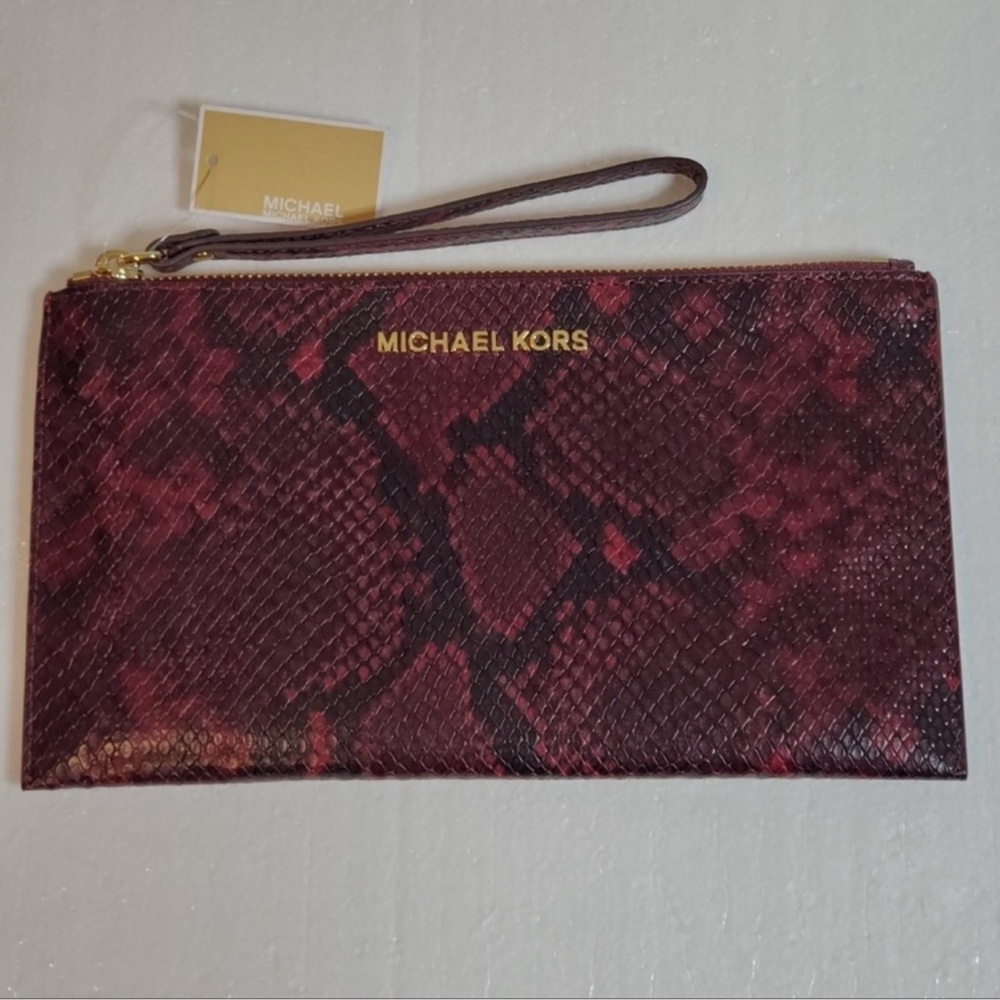 NWOT Michael Kors printed wristlet/clutch.